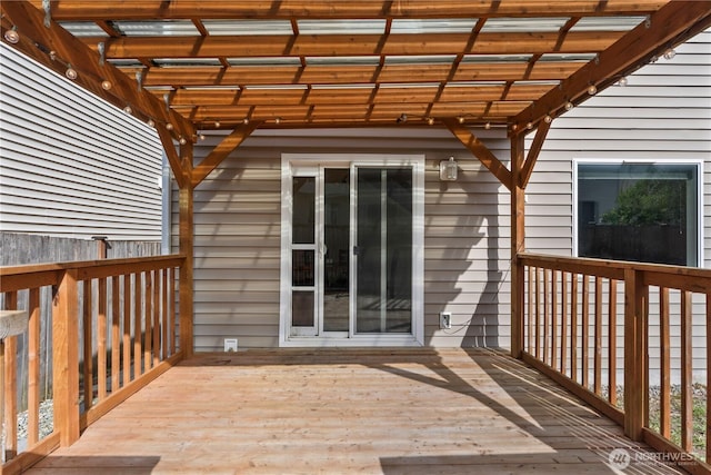 wooden deck featuring a pergola