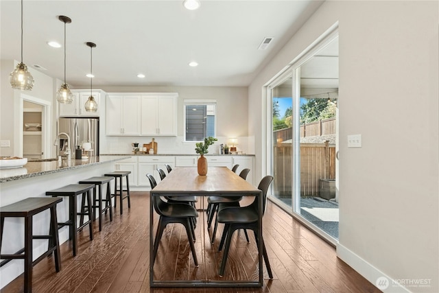 dining area featuring recessed lighting, dark wood-style flooring, and visible vents