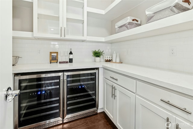 bar featuring decorative backsplash, a dry bar, dark wood-type flooring, and wine cooler