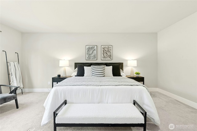 bedroom featuring baseboards and light carpet