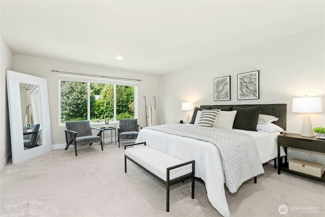 bedroom with baseboards, recessed lighting, and light colored carpet