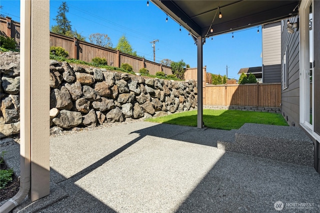 view of patio featuring a fenced backyard