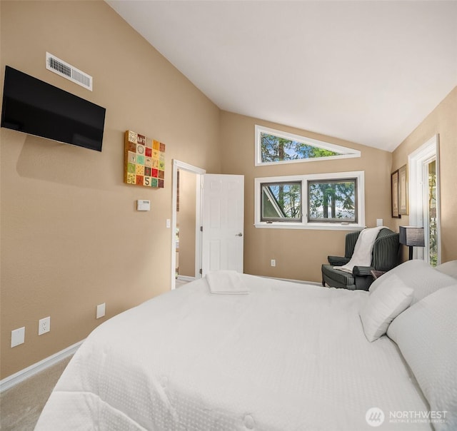 bedroom featuring visible vents, carpet flooring, baseboards, and vaulted ceiling