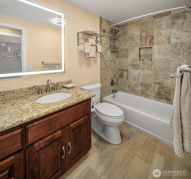 full bathroom featuring vanity, toilet, and shower / washtub combination