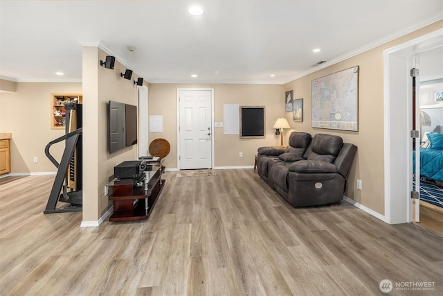 living area featuring ornamental molding, light wood finished floors, and recessed lighting