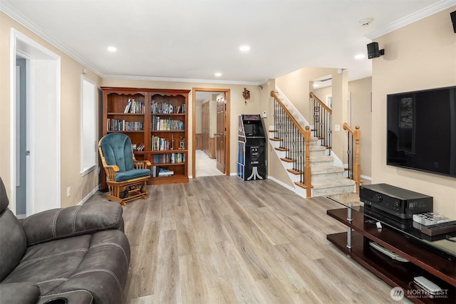 living room with crown molding, stairs, and wood finished floors