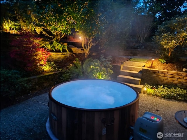 exterior space with stairs and a jacuzzi