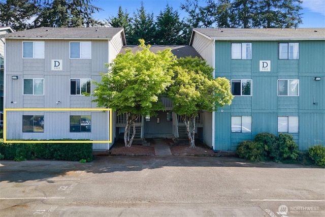 view of property featuring stairway