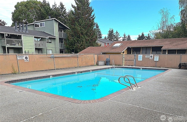 community pool with fence