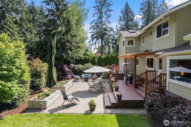 deck with an outdoor hangout area and a patio area