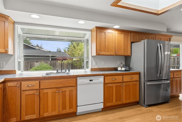 kitchen featuring light wood-style floors, freestanding refrigerator, dishwasher, and recessed lighting