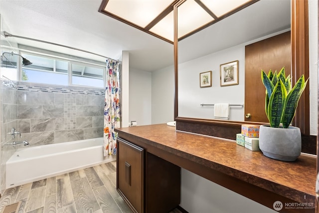 full bath with shower / bath combo with shower curtain, wood finished floors, visible vents, and vanity