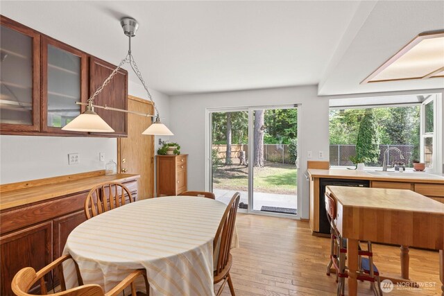 dining space featuring light wood-style flooring