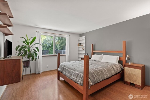 bedroom featuring wood finished floors
