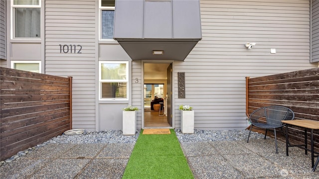 property entrance with fence