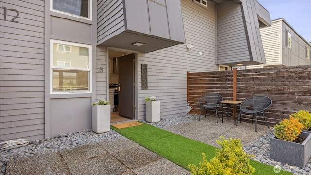 exterior space with fence and a patio