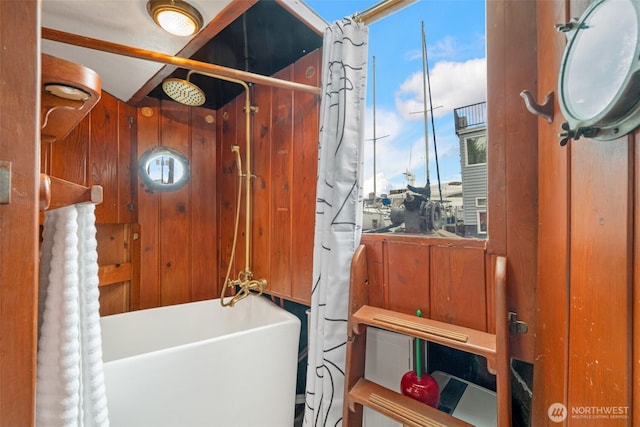 full bath with a freestanding bath