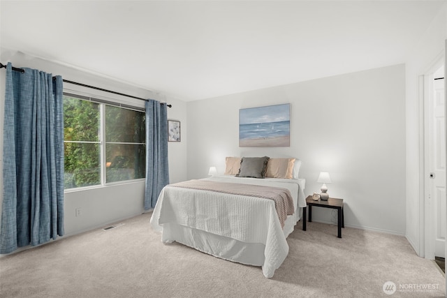 bedroom featuring carpet floors, baseboards, and visible vents