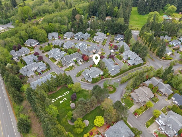 birds eye view of property with a residential view
