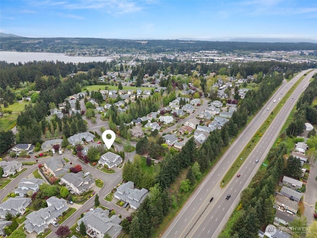 bird's eye view featuring a water view and a residential view