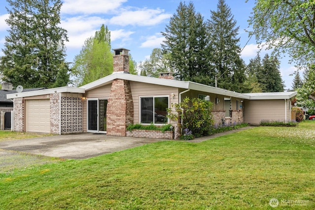 2617 College St SE, Lacey, WA 98503 - back of house featuring a garage, a chimney, a lawn, and brick siding