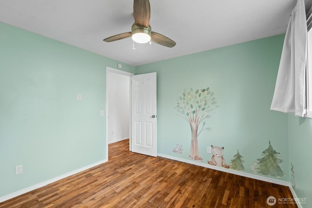 2617 College St SE, Lacey, WA 98503 - unfurnished bedroom featuring baseboards, ceiling fan, and wood finished floors