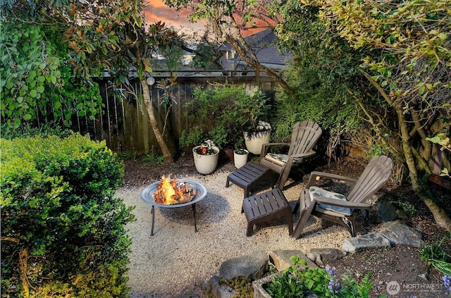 12739 7th Ave NW, Seattle, WA 98177 - view of patio featuring an outdoor fire pit and fence