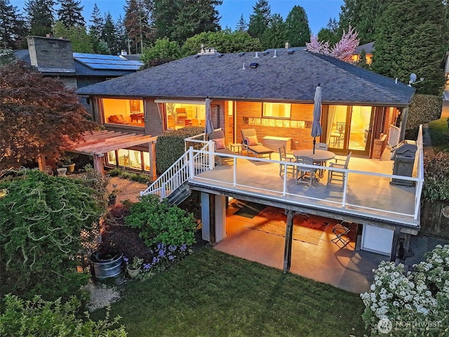 12739 7th Ave NW, Seattle, WA 98177 - back of property featuring a shingled roof, a yard, and stairway