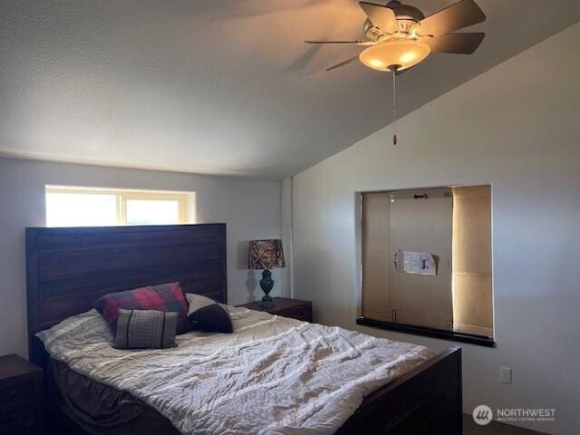 bedroom featuring ceiling fan and lofted ceiling