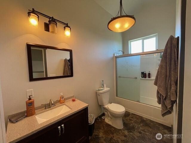 full bath featuring vanity, enclosed tub / shower combo, and toilet