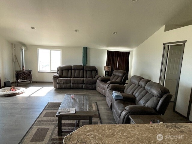living area featuring wood finished floors and a wood stove
