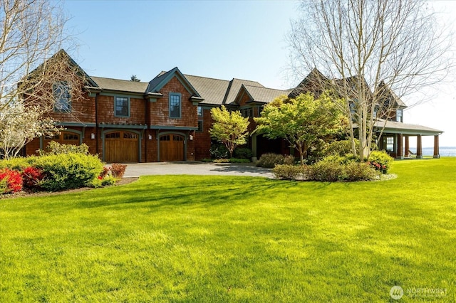 5848 Mutiny Bay Rd, Freeland, WA 98249 - view of front facade featuring an attached garage, driveway, and a front yard