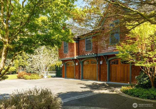 5848 Mutiny Bay Rd, Freeland, WA 98249 - view of front of house featuring an attached garage and driveway