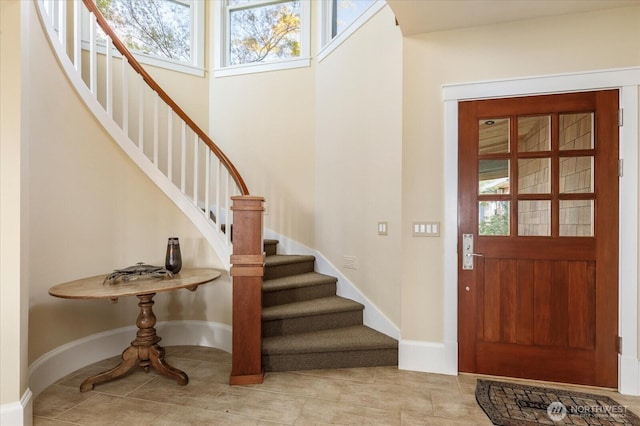 5848 Mutiny Bay Rd, Freeland, WA 98249 - tiled foyer featuring baseboards and stairway