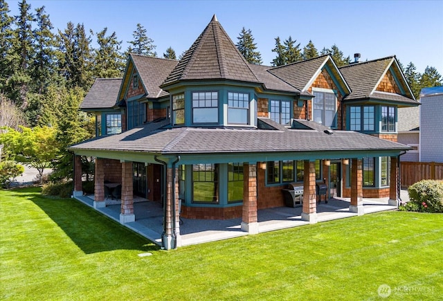 5848 Mutiny Bay Rd, Freeland, WA 98249 - back of house with a lawn, fence, and a patio area