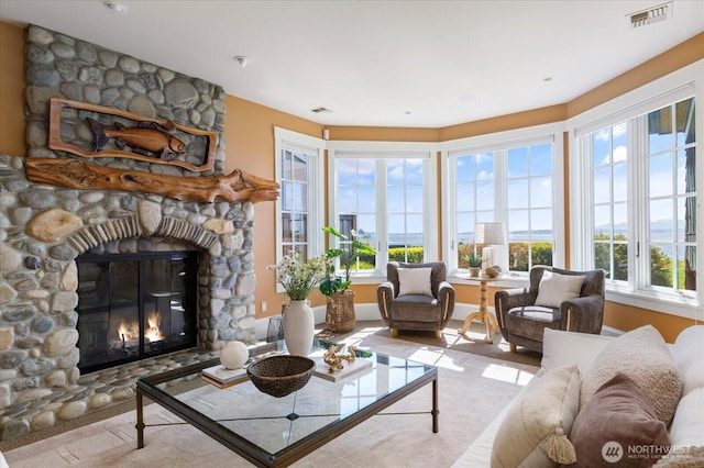 5848 Mutiny Bay Rd, Freeland, WA 98249 - living room featuring a stone fireplace and visible vents
