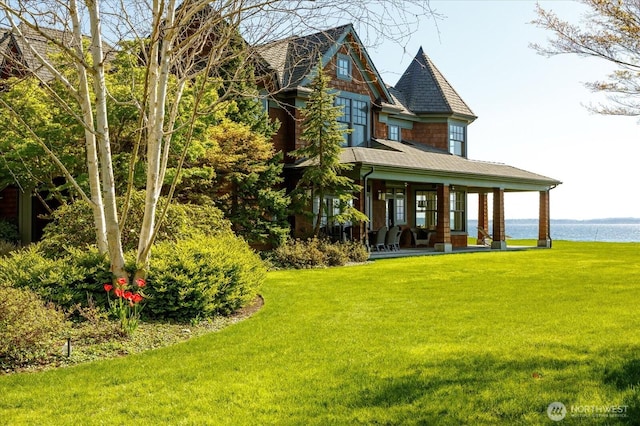 5848 Mutiny Bay Rd, Freeland, WA 98249 - rear view of property with a lawn, covered porch, a water view, and roof with shingles