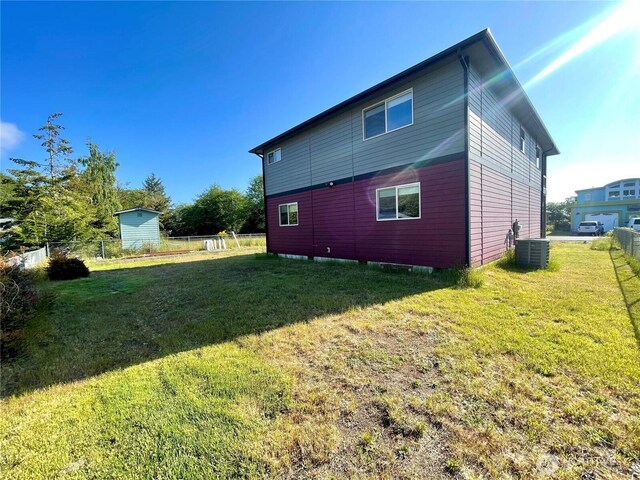 415 Olympic View Dr NE, Ocean Shores, WA 98569 - back of house featuring central air condition unit