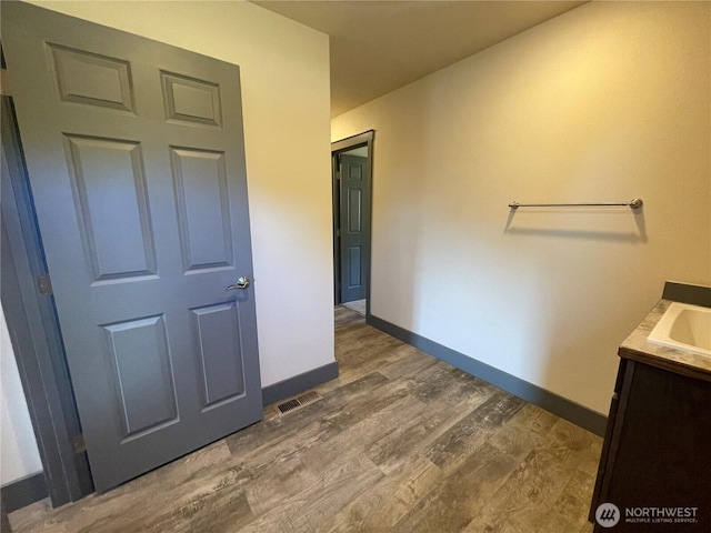 415 Olympic View Dr NE, Ocean Shores, WA 98569 - bathroom with wood finished floors, vanity, and baseboards