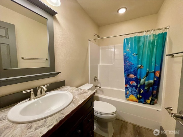 415 Olympic View Dr NE, Ocean Shores, WA 98569 - bathroom featuring shower / bath combo with shower curtain, vanity, and toilet