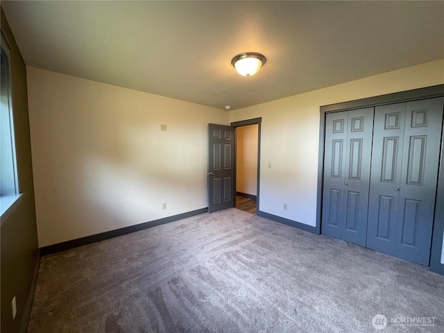 415 Olympic View Dr NE, Ocean Shores, WA 98569 - unfurnished bedroom featuring carpet floors, baseboards, and a closet