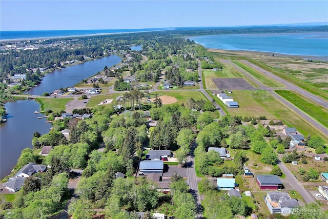 415 Olympic View Dr NE, Ocean Shores, WA 98569 - aerial view of property and surrounding area featuring a nearby body of water