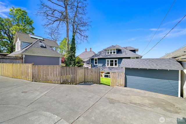 view of front of house featuring a patio and fence