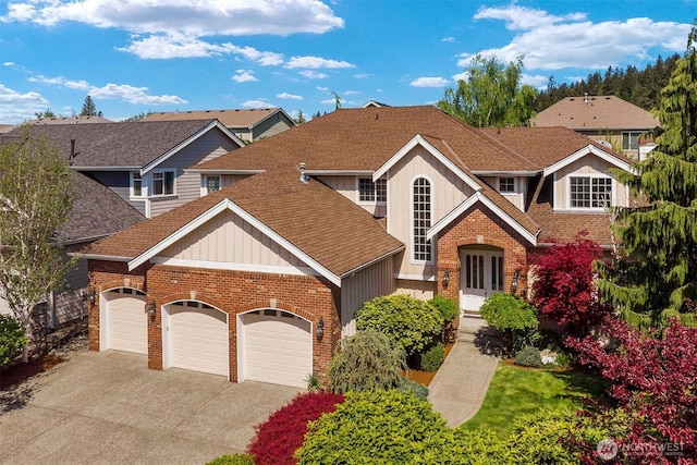 13914 SE 88th Pl, Newcastle, WA 98059 - traditional home with brick siding, a garage, and roof with shingles