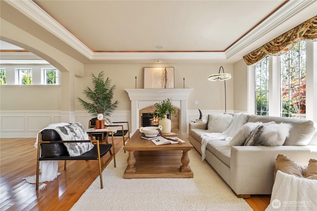 13914 SE 88th Pl, Newcastle, WA 98059 - sitting room with ornamental molding, a wealth of natural light, a raised ceiling, and wood finished floors
