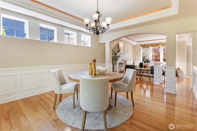 13914 SE 88th Pl, Newcastle, WA 98059 - dining area with arched walkways, ornamental molding, and plenty of natural light
