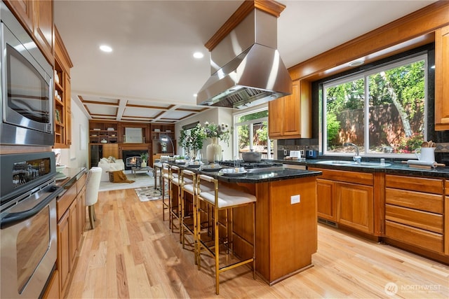 13914 SE 88th Pl, Newcastle, WA 98059 - kitchen featuring a sink, stainless steel appliances, open floor plan, island range hood, and coffered ceiling