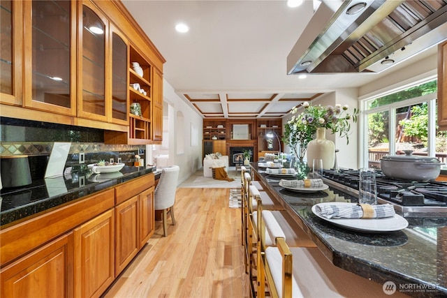 13914 SE 88th Pl, Newcastle, WA 98059 - kitchen with glass insert cabinets, recessed lighting, wall chimney exhaust hood, coffered ceiling, and light wood-style flooring