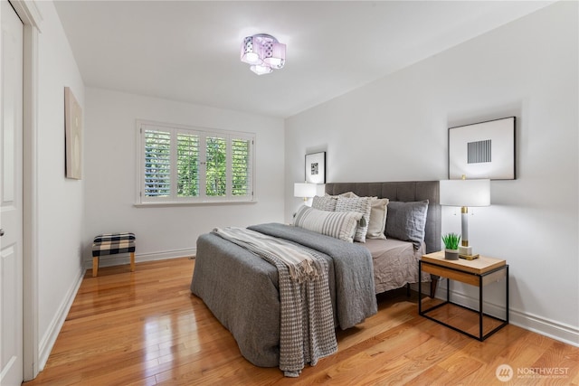 13914 SE 88th Pl, Newcastle, WA 98059 - bedroom featuring baseboards and light wood finished floors