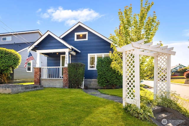 1002 S Adams St, Tacoma, WA 98405 - view of front of property featuring a front yard, a pergola, and a porch